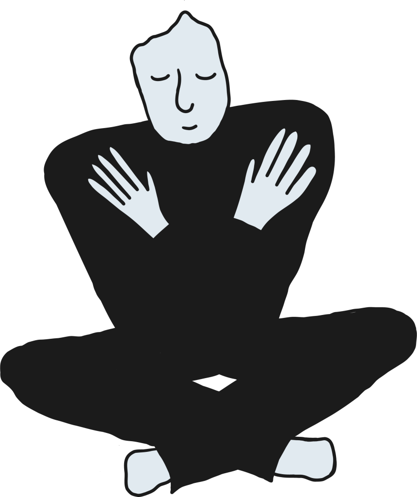 A person sitting cross-legged with eyes closed and hands resting calmly on their chest, expressing creative fulfillment